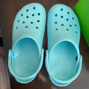 Ice Blue Crocs for kids. Size J 5. Never been worn, still in the box!